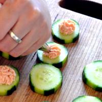 Pipe the mousse onto the canapés